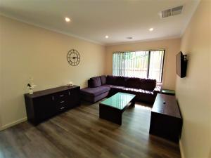 a living room with a couch and a table at My Place in Albury in Albury