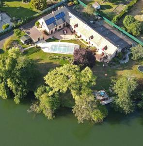 an overhead view of a large house with a swimming pool at Le Clos Bener in Yvré-lʼÉvêque