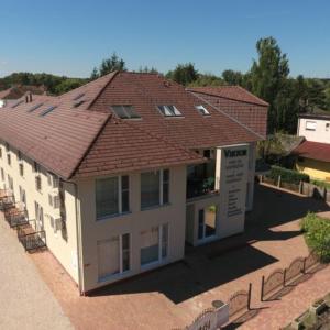 an overhead view of a building with a roof at Viktor Bor- és Vendégház**** in Balatonmáriafürdő