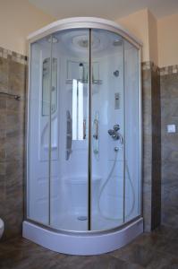 a shower with a glass enclosure in a bathroom at Huertas de la Fuente in Cella