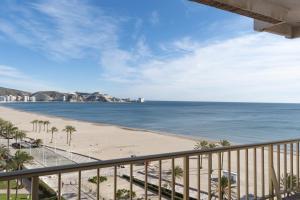 a view of the beach from the balcony of a condo at Arensol Esc-A, 13º-51 in Cullera