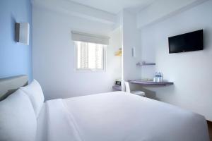 Katil atau katil-katil dalam bilik di Amaris Hotel Pakuan Bogor
