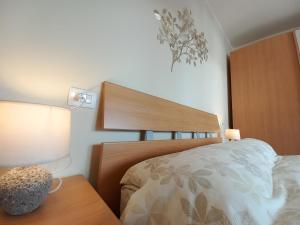 A bed or beds in a room at Elegante bilocale a pochi passi dal mare