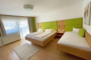 Postel nebo postele na pokoji v ubytování B&B Landhaus Vierthaler