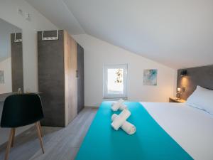 Łóżko lub łóżka w pokoju w obiekcie Villa Vinky