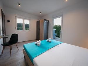 Łóżko lub łóżka w pokoju w obiekcie Villa Vinky