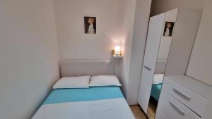 Posteľ alebo postele v izbe v ubytovaní Apartment Lada