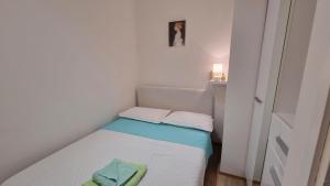 Posteľ alebo postele v izbe v ubytovaní Apartment Lada