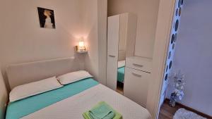 Posteľ alebo postele v izbe v ubytovaní Apartment Lada