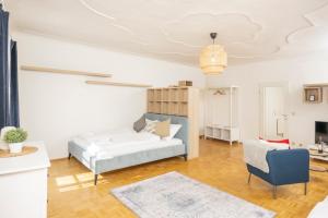 Posteľ alebo postele v izbe v ubytovaní Cozy Kunsthaus GRAZ