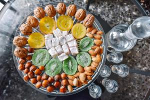 a tray of food with nuts and fruit on a table at City Vibes "by Checkin" in Heraklio Town