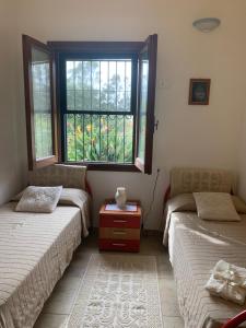 Postel nebo postele na pokoji v ubytování Casa Nerelie'S