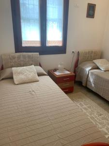 Postel nebo postele na pokoji v ubytování Casa Nerelie'S