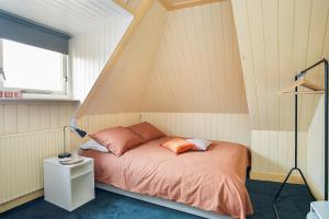Een bed of bedden in een kamer bij Vakantiewoning Suderhaven