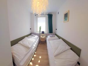 Postel nebo postele na pokoji v ubytování Apartament Botanika