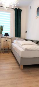 Postel nebo postele na pokoji v ubytování Apartament Botanika