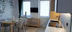 TV a/nebo společenská místnost v ubytování Apartament Botanika