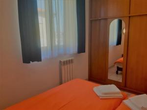 Posteľ alebo postele v izbe v ubytovaní Apartments Barbara Gregovica