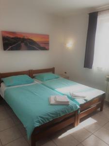 Posteľ alebo postele v izbe v ubytovaní Apartments Barbara Gregovica