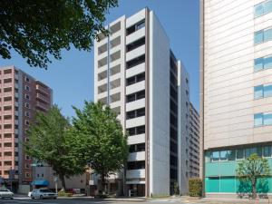 福岡市にあるFFFFFFホテルの高い白い高い建物2棟前