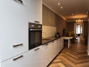 Kuchyň nebo kuchyňský kout v ubytování Boutique Hotel Huys van Leyden
