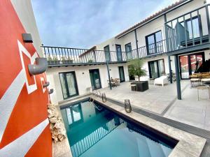 a swimming pool in front of a building at Villa Rio by Valada Village in Valada