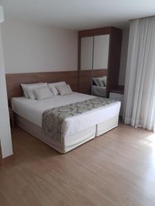 Krevet ili kreveti u jedinici u okviru objekta Vista Azul Apart Hotel - Vista Pinheiros