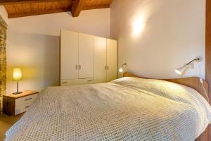 Ένα ή περισσότερα κρεβάτια σε δωμάτιο στο Appartamento Ramma La Taggiasca