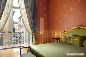 A bed or beds in a room at La Casa Sul Nilo