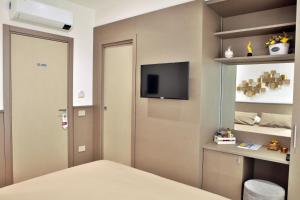 TV a/nebo společenská místnost v ubytování B&B Casa Rubino