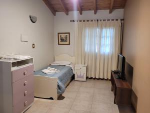 En eller flere senger på et rom på Casa Mendoza Capital cerca del Parque y Centro