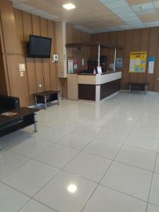 a waiting room with two tables and a counter at Hotel Zora in Kranevo +18 photos