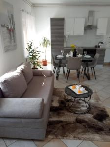a living room with a couch and a table at Studio apartman KIKA in Otočac