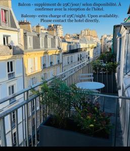 a view from a balcony of a building at Best Western Plus Hôtel Littéraire Marcel Aymé in Paris