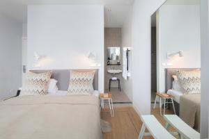 Postel nebo postele na pokoji v ubytování Stadsvilla Hotel Mozaic Den Haag