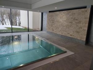 a swimming pool in the middle of a house at Ferienwohnung Seestern in Schluchsee