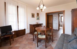 a living room with a table and a couch at Casa Fiori di Pesco - Goelba in Marciana Marina