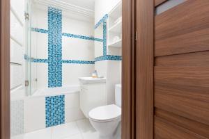 Koupelna v ubytování Family Apartment Saska Kępa by Noclegi Renters