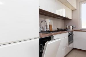 Kuchyň nebo kuchyňský kout v ubytování Family Apartment Saska Kępa by Noclegi Renters