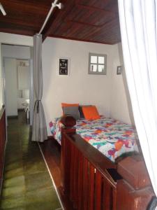 a bedroom with a bed in a room at Casa com Piscina Paraty in Paraty