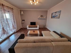 a living room with a couch and a coffee table at Apartments Vukic in Crikvenica