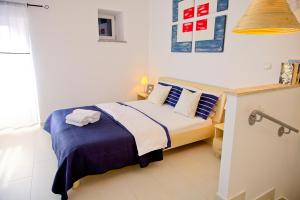 Postel nebo postele na pokoji v ubytování Apartments Stefani
