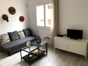 TV a/nebo společenská místnost v ubytování Àtico lumineux à 10 min du centre ville