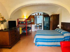 a bedroom with a bed and a bunk bed at Casa Vacanze Fattoria Pozzitello in San Salvo