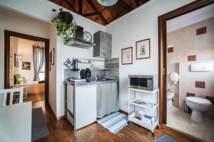 a bathroom with a sink and a toilet at Studio Apartments Centro Storico Via Manno in Cagliari
