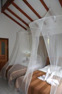 Postel nebo postele na pokoji v ubytování Villa Veuve Casadani Hotel