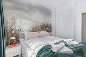 Posteľ alebo postele v izbe v ubytovaní Seaside Apartamenty - Olimpijska 2 Mielno - Sauna & Fitness & Parking - w cenie pobytu
