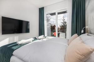 Posteľ alebo postele v izbe v ubytovaní Seaside Apartamenty - Olimpijska 2 Mielno - Sauna & Fitness & Parking - w cenie pobytu