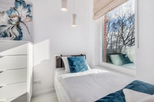 Posteľ alebo postele v izbe v ubytovaní Seaside Apartamenty - Olimpijska 2 Mielno - Sauna & Fitness & Parking - w cenie pobytu