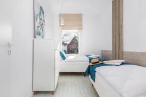 Posteľ alebo postele v izbe v ubytovaní Seaside Apartamenty - Olimpijska 2 Mielno - Sauna & Fitness & Parking - w cenie pobytu